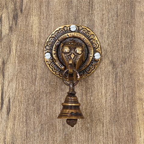 Ganesh Face Wall Hanging With Bells Online - eCraftIndia Online