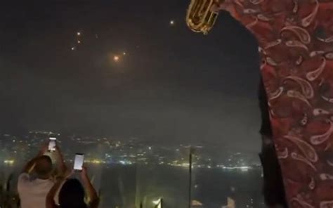 Israel-Iran crisis: Party goers in Lebanon click missiles streaking ...