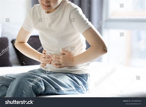 Gastric Pains Asian Woman Stock Photos and Pictures - 427 Images | Shutterstock
