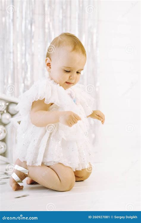 Child, Little Girl Standing on His Knees. Baby in White Dress Stock ...