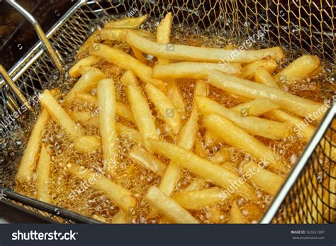 French Fries In A Deep Fryer Closeup Stock Photo 162651287 : Shutterstock