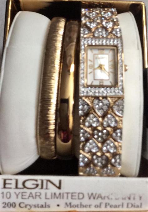 ELGIN Women's Gold Watch 200 Crystals Rectangle Pearl Dial Numbered ...