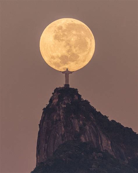 The Mountaintop Christ the Redeemer Statue Cradles the Moon in Rio de Janeiro — Colossal