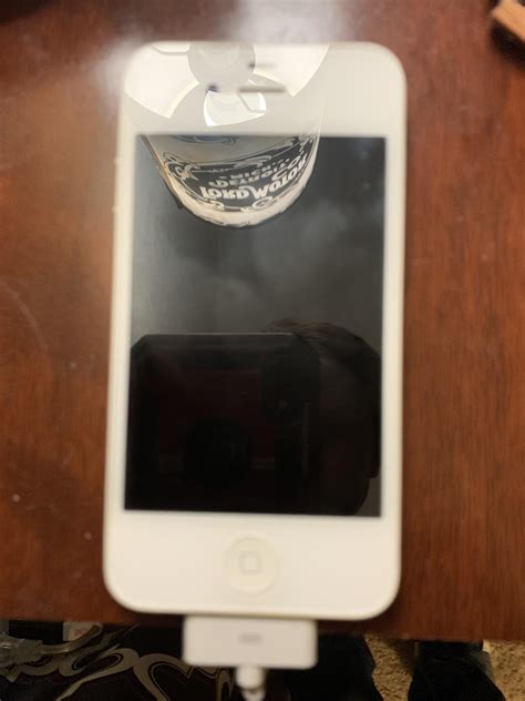 Found my mom's old iphone 4. I've had this phone plugged in for an hour. No sign of any life at ...