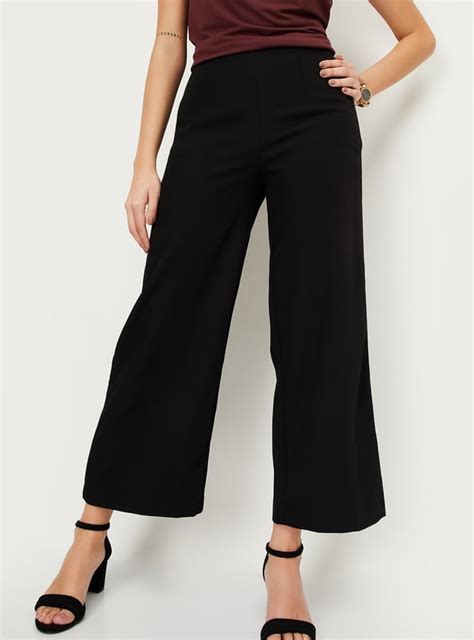 Buy Women Solid Wide Leg Formal Trousers Online at just Rs. 1299.0 ...