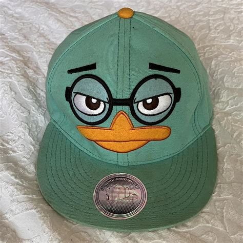 Perry the platypus hat, dirt and dust spots,... - Depop