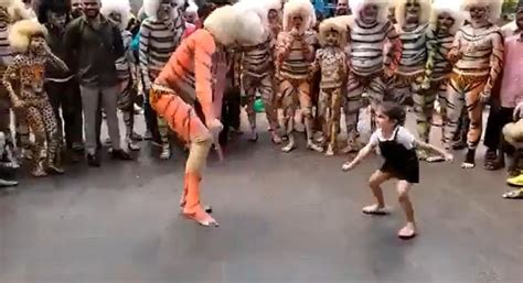 Little Girl Joins Street Artists In Performing Folk Dance