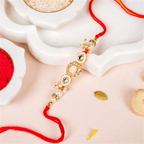 Stone And Pearl White Kundan Rakhi Set For Couple Online - Premium Gift ...