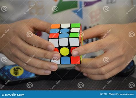 Close-up of Hands Solving a Rubik`s Cube. Color Puzzle Editorial Image ...