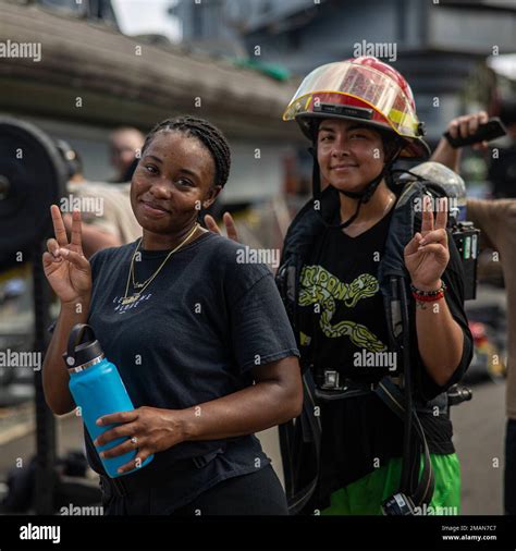 U.S. Navy Seaman Apprentice Josette Lavine and Seamen Amanda Lynn Ochoa assigned to amphibious ...