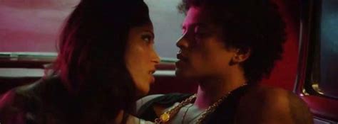 Hot as hell! Freida Pinto strips for Bruno Mars in a racy music video ...