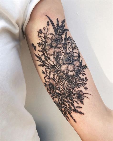 bicep tattoos on women