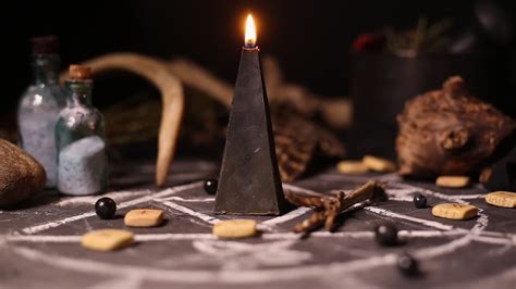 Black magic candles burn. Smoke on the background of the magical ...