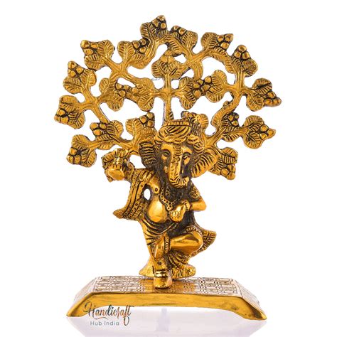Golden Lord Ganesha Playing Flute Under A Tree Showpiece – eCraftIndia