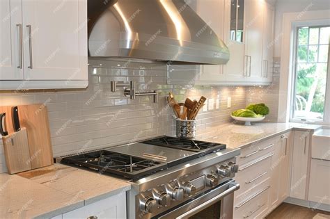 Premium Photo | Stainless steel hood installed on a new kitchen