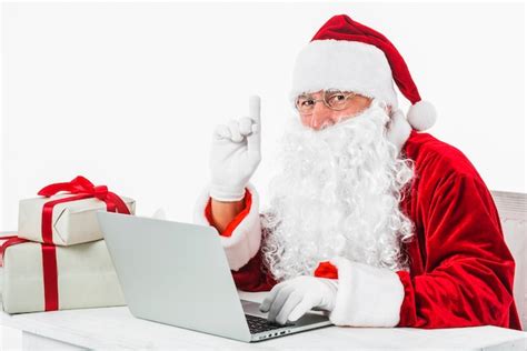 Santa claus in glasses showing pointing finger | Premium Photo