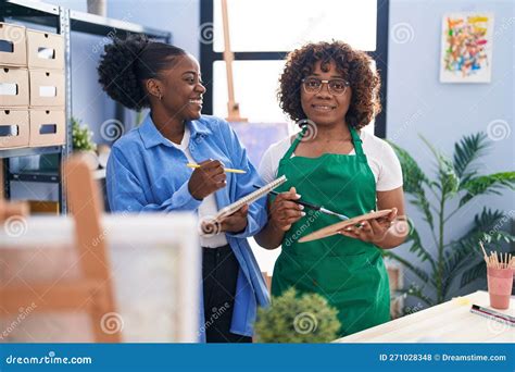 African American Women Artists Holding Palette and Paintbrush at Art ...