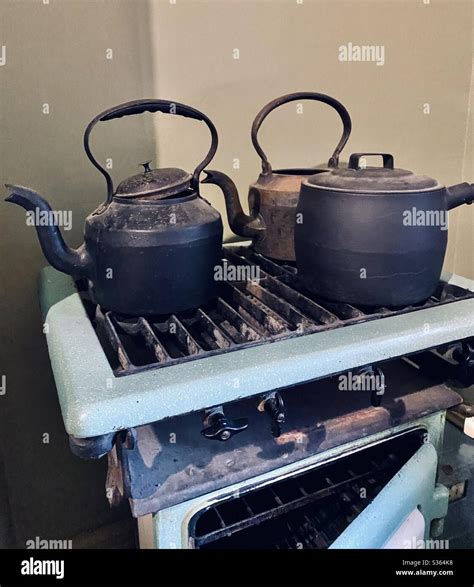 Antique tea kettle and stove Stock Photo - Alamy