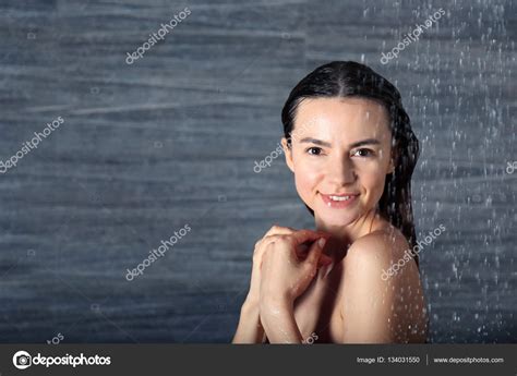 Woman taking shower at home — Stock Photo © belchonock #134031550