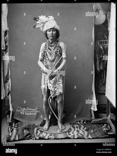 This photograph by Lee Moorhouse shows a Columbia River Indian, dressed ...