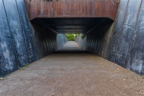 Entrance to a metal tunnel with its blue walls & garnet ceiling at olot ...