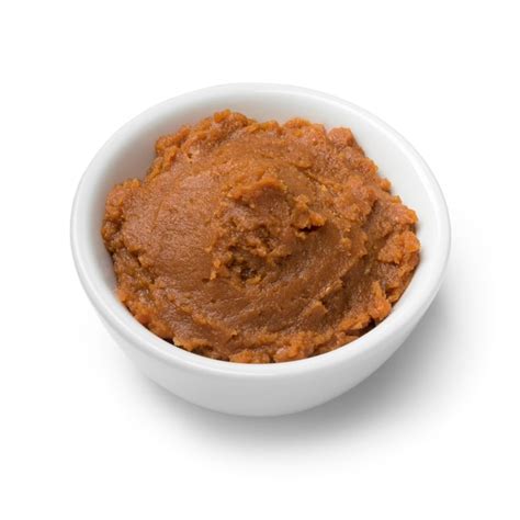 Bowl with japanese miso paste as an ingredient isolated on white ...