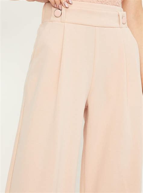 Buy Women Solid Regular Fit Flared Trousers Online at just Rs. 999.0 ...