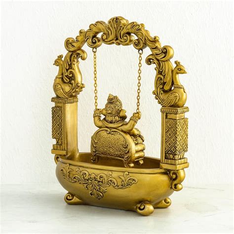 Buy Dhyana Gold Textured Polyresin Ganesha On Swing Figurine from Home ...