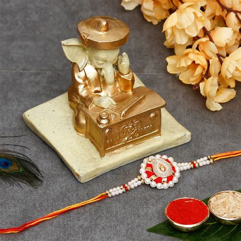 Designer Handcrafted Rakhi with Handcrafted Ganesha Showpiece and Roli ...