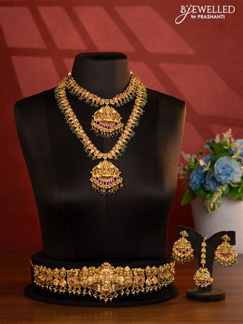 Antique bridal set lakshmi design with jadau cz stones and green beads ...