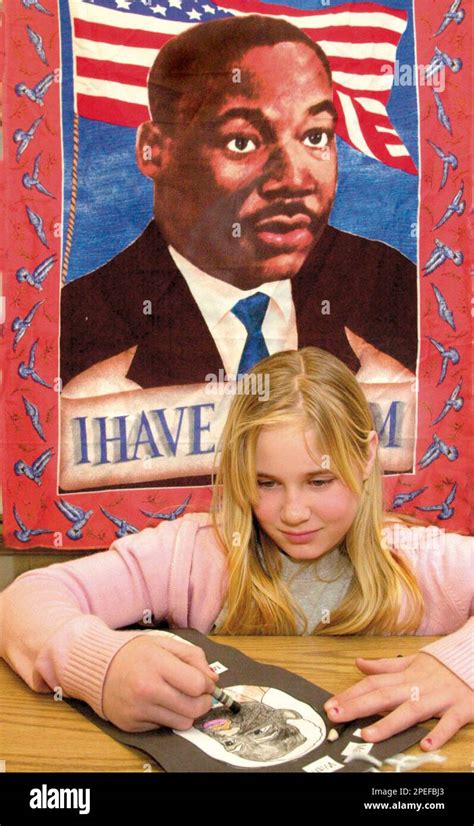 Brittany Coble, 10, draws a picture of The Rev. Martin Luther King Jr ...