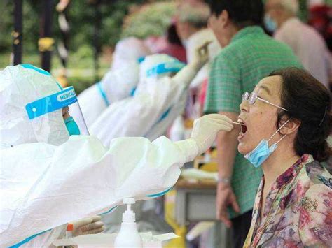 China tests millions, imposes new travel restrictions as virus cases ...