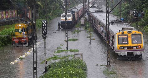 Mumbai rain in photos: Roads, railway tracks waterlogged after heavy ...