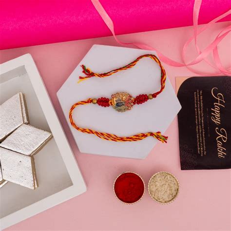 Send Golden Peacock Rakhi with Kaju Katli Online