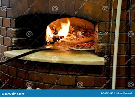 Pizza in a Traditional Oven Stock Photo - Image of ready, cuisine: 34749090