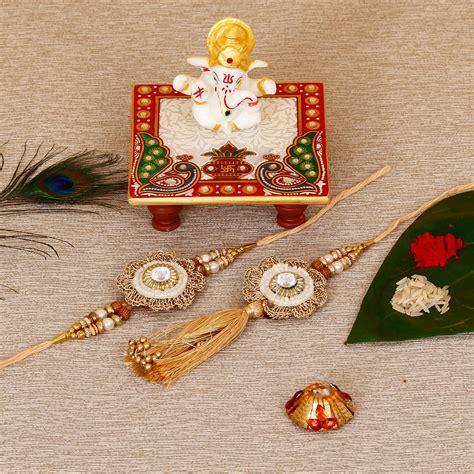 Designer Bhaiya Bhabhi Rakhi with Lord Ganesha Marble Chowki and Roli ...