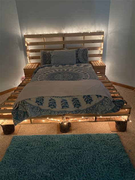 Wood pallet bed w/tree stumps | Pallet bed frames, Diy pallet bed, Wood ...