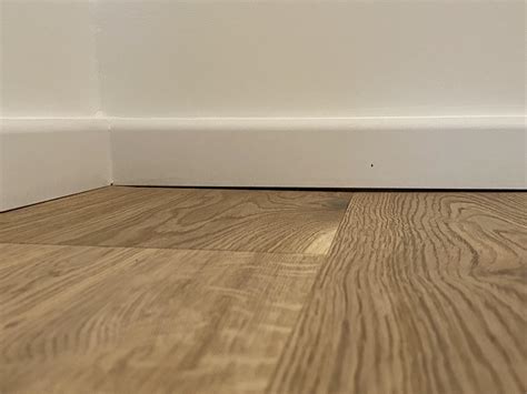 Should I caulk underneath the baseboards to remove the unsightly gaps ...