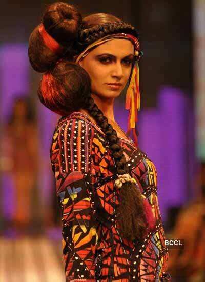 A model showcases a creation by designer Malini Ramani on Day 5 of ...