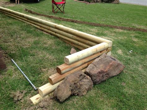 How To Build A Retaining Wall Using Landscape Timbers - Design Talk