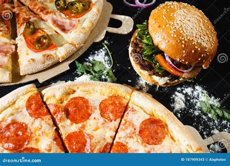Pizza and Burger on a Black Background. Top View Stock Image - Image of ...