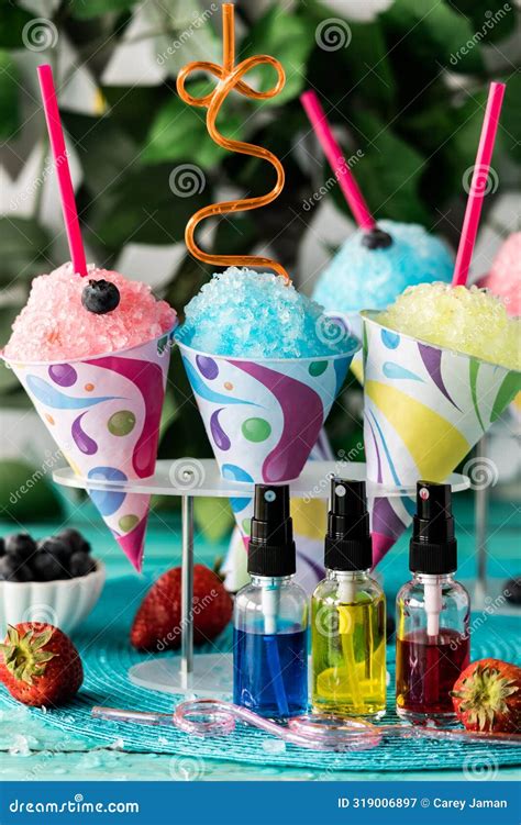 Colourful Homemade Snow Cones with Fruit Flavoured Syrups in Front ...