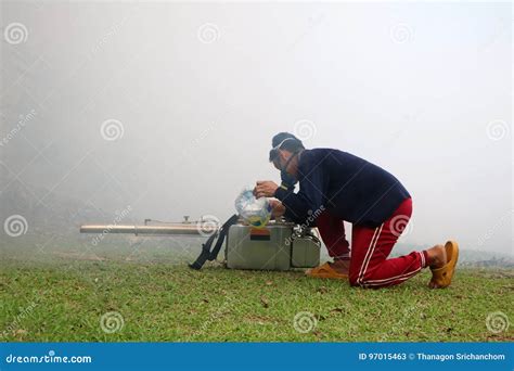Worker with Smoke and Fogging Machine in the Garden Editorial Stock ...
