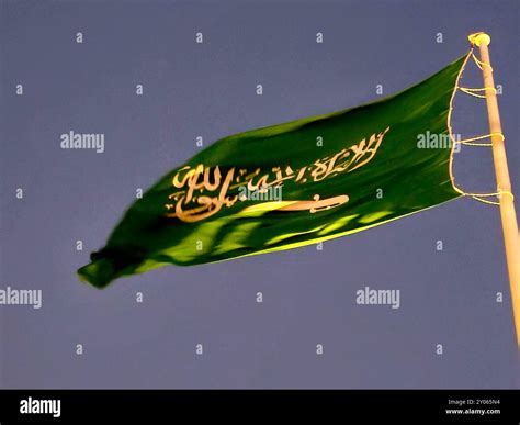 The national flag of Saudi Arabia kingdom, a green background with Arabic inscription and a ...