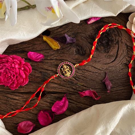 Kundan Stone Lakshmi Pendant Rakshabandhan Rakhi-Red-G13005 – vrikshamindia