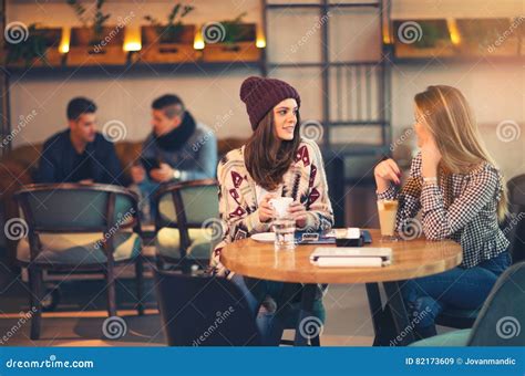 Two Friends Enjoying Coffee Together in a Coffee Shop Stock Image ...