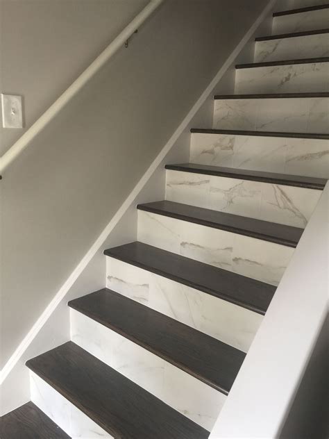 Marble look porcelain tiled stair risers. | Tiled staircase, Stairs ...
