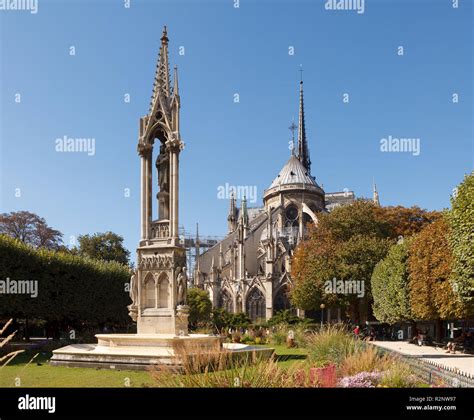 Apse of Notre-Dame de Paris and La fontaine de la Vierge from Square Jean-XXIII. Paris, France ...