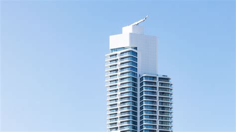 Download wallpaper 1600x900 building, facade, white, sky widescreen 16: ...
