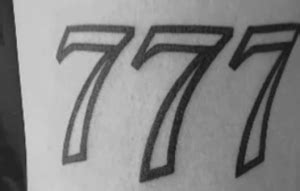 777 spine tattoo,This design symbolizes luck and fortune